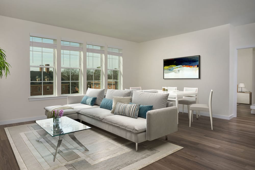 Beautiful living room area with hardwood style flooring at The Ella Scott's Addition in Richmond, Virginia