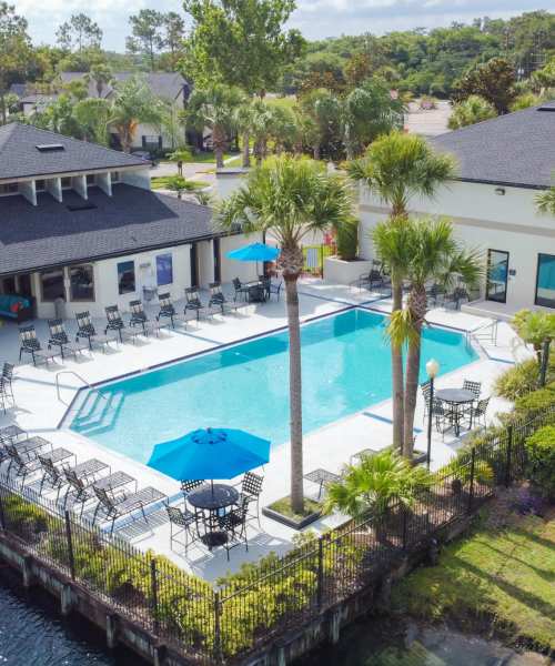View of pool and landscaped greenery at Cypress Run in Orlando, Florida