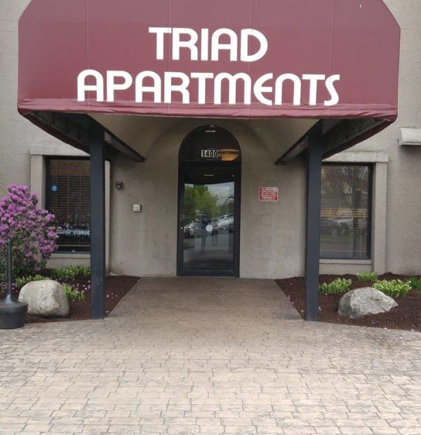 Triad Apartments sign