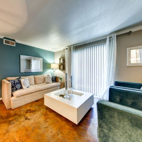 Bright and open living room with access to private balcony at Austin Midtown in Austin, Texas