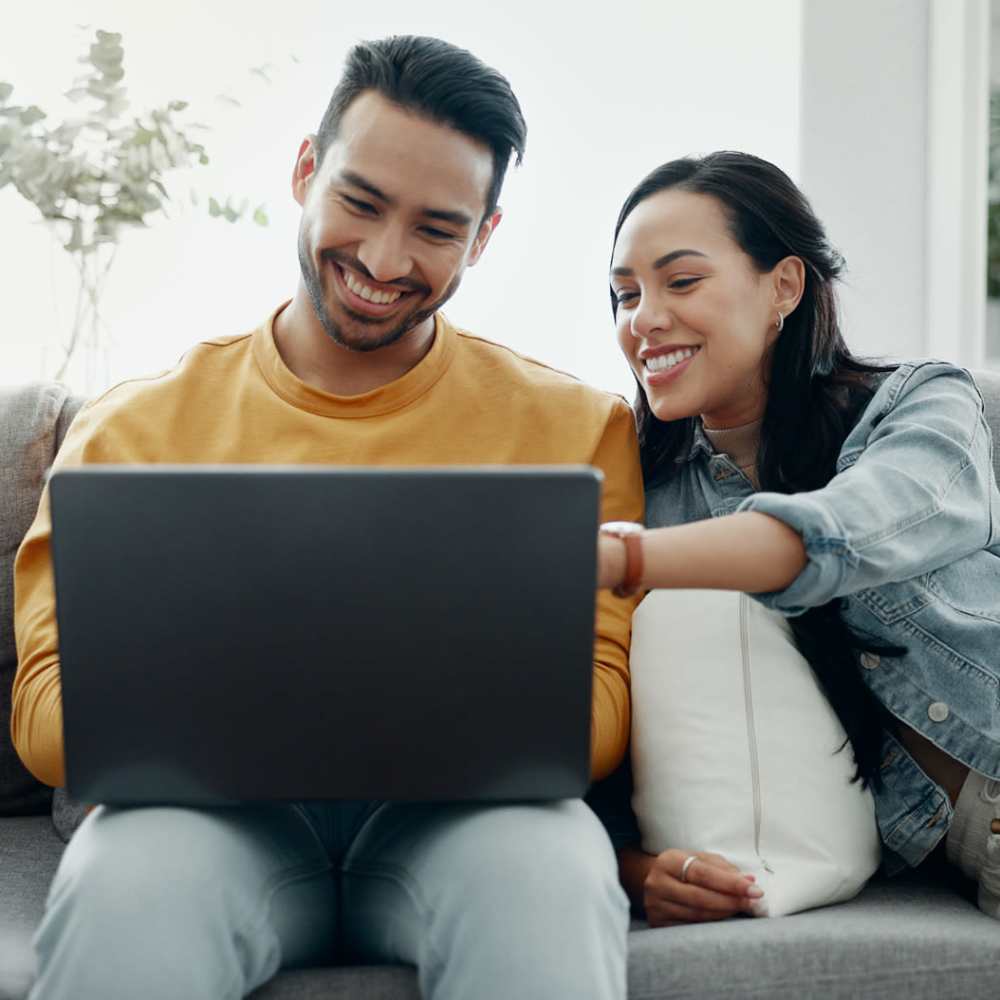 Resident couple in their living room at Flatiron West Trade in Charlotte, North Carolina