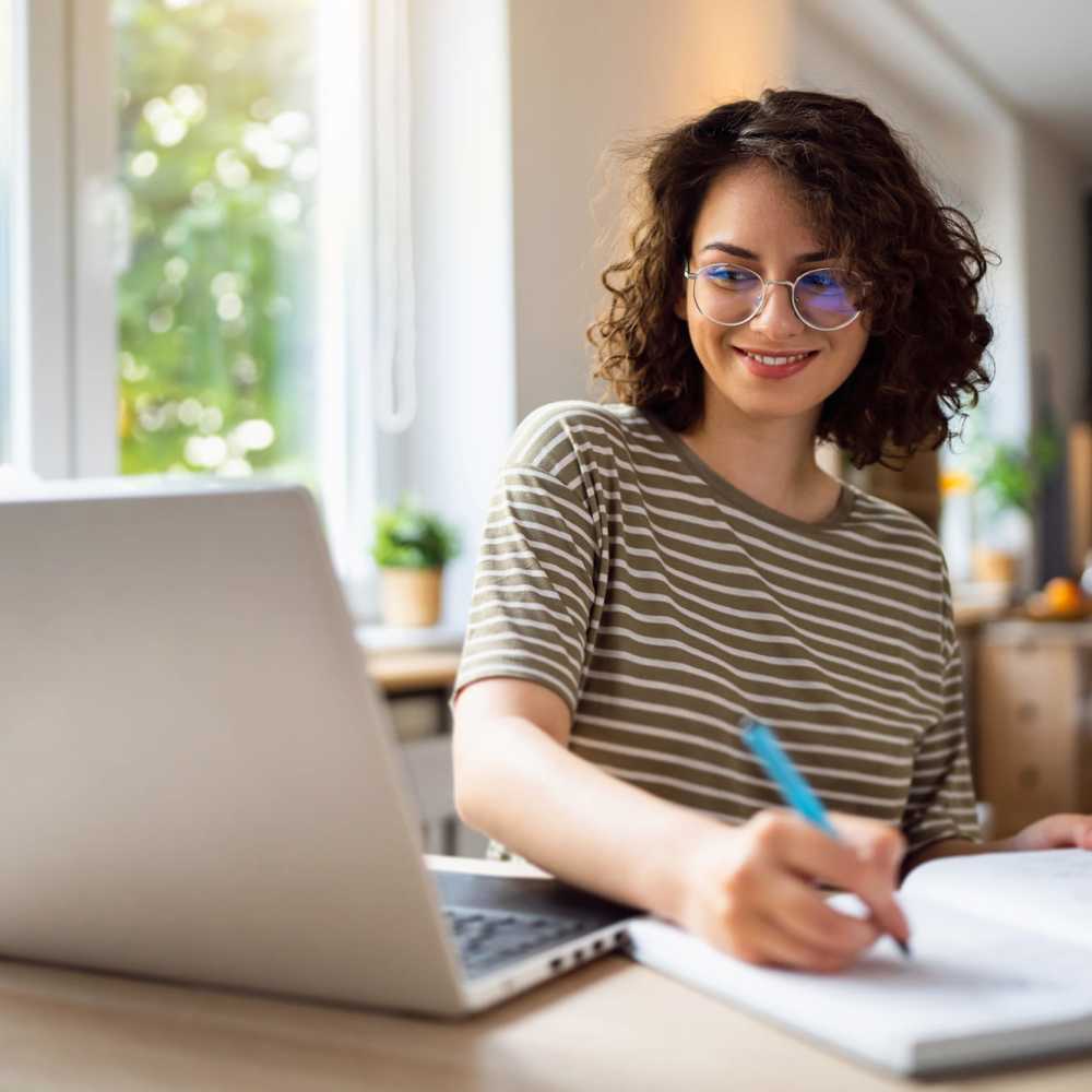 Resident working in a business center provided at The Elms at Germantown in Germantown, Maryland