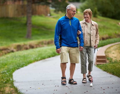 Couple walking along path at Christian Living Communities