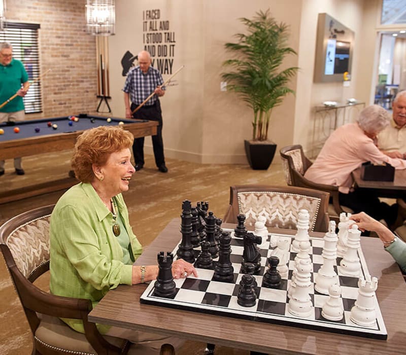 Resident playing chess at Celebration Village Acworth in Acworth, Georgia