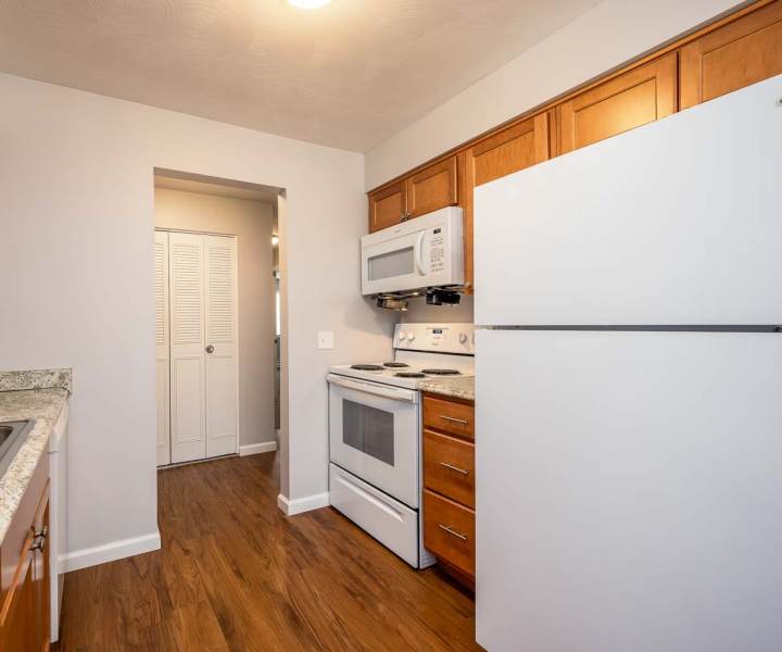 Kitchen with wooden flooring at Eastway Manor Apartments in Webster, New York