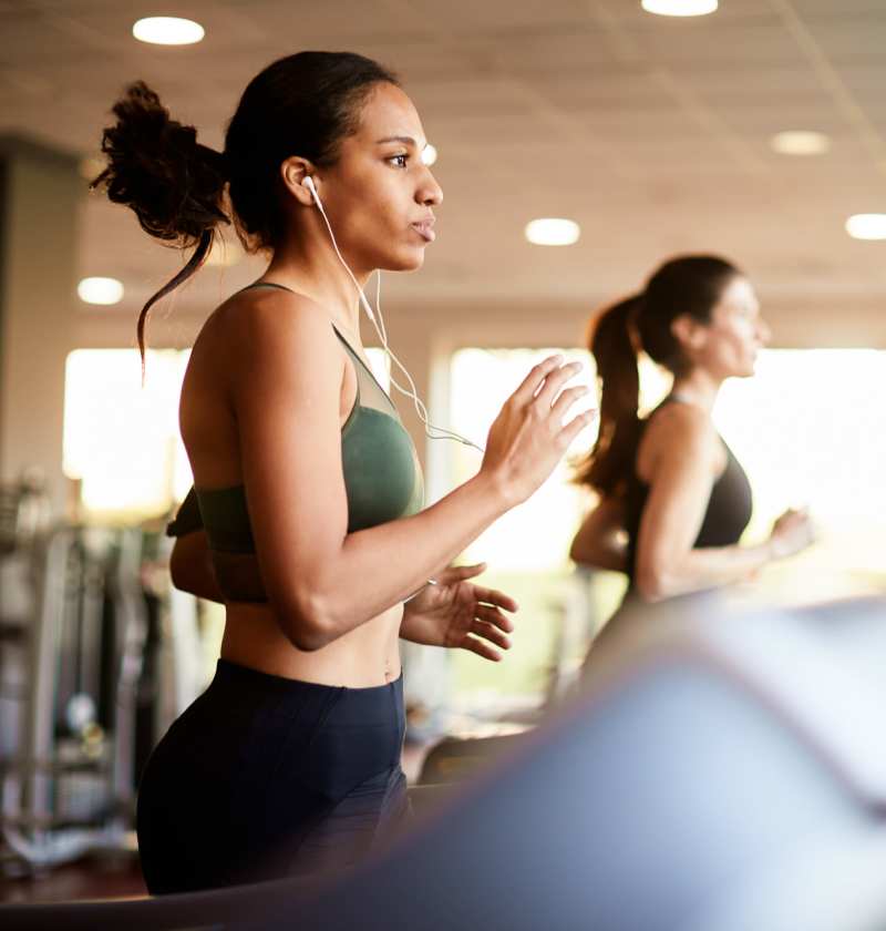 Residents doing workouts in the fitness center near Altitude on Main in Richmond, Virginia