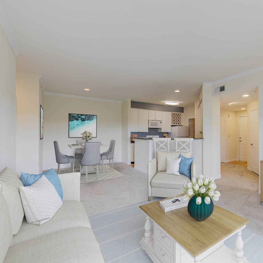 Charming living space with modern kitchen and cozy dining area at Boulder Springs in Maryland Heights, Missouri.