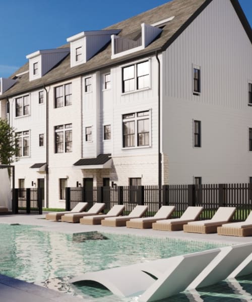A luxurious outdoor pool area with comfortable lounge chairs at One West End in Charlotte, North Carolina