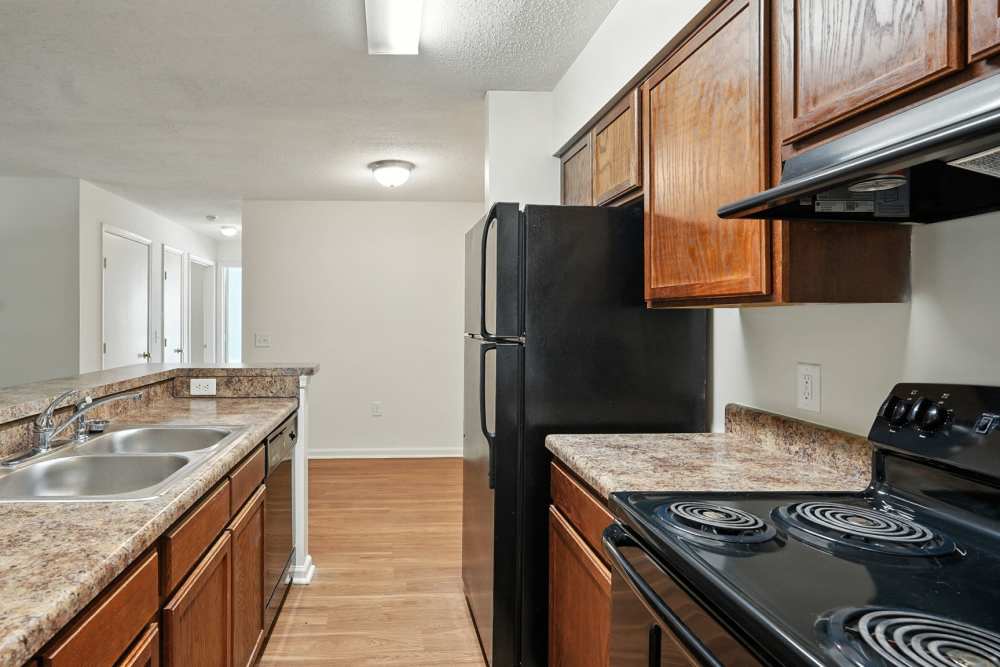 Kitchen with wooden cabinets at Monmouth Woods in King George,Virginia