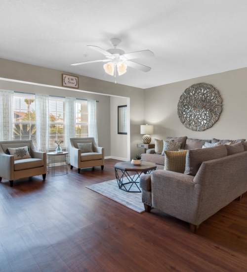 Spacious living room with seating spaces at Reserve at Northshore in Lynn Haven, Florida
