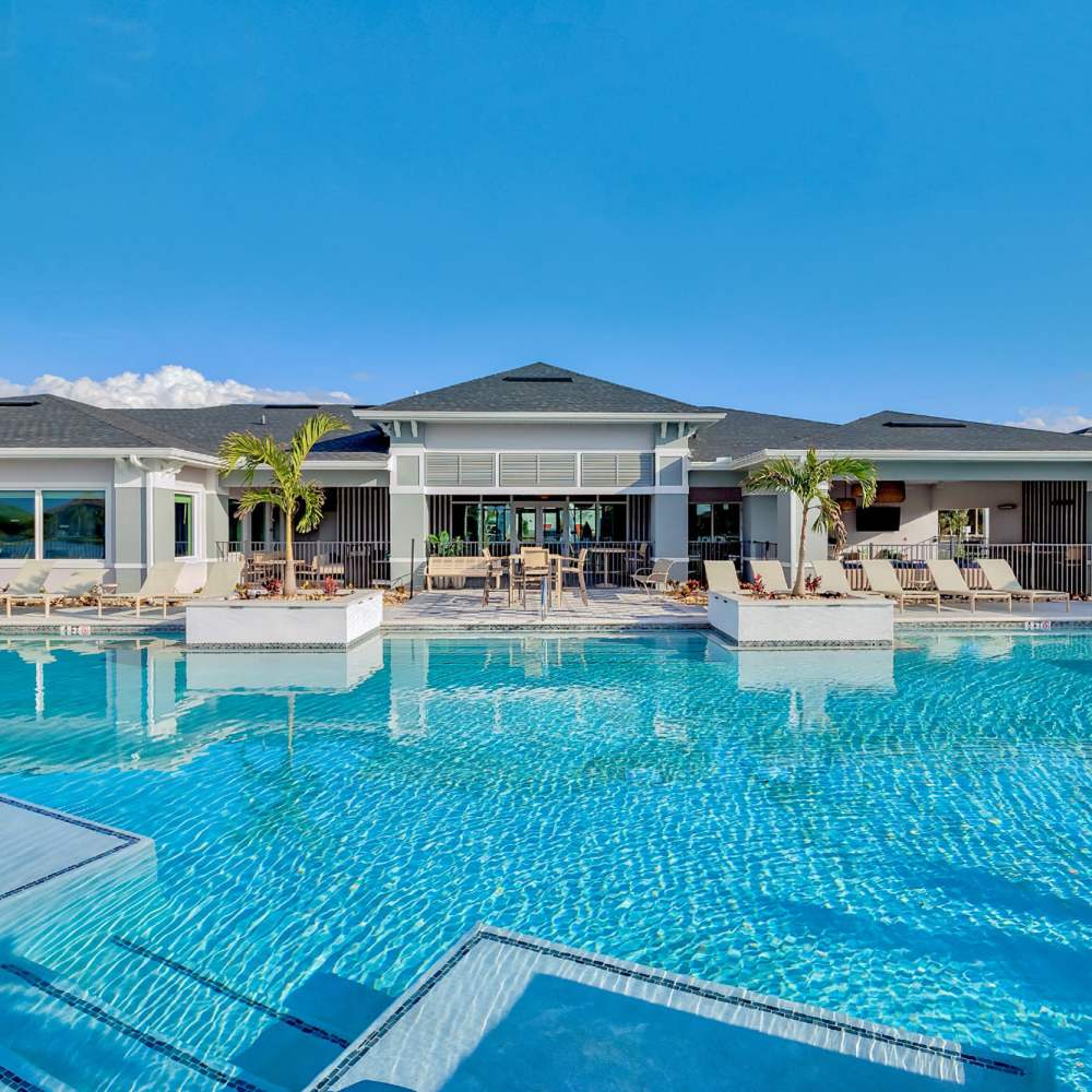 Swimming pool with lounge beds at Charlotte Commons in Port Charlotte,Florida