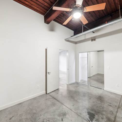 Unfurnished bedroom with sliding glass door at Stadium Loft Apartments in Saint Louis, Missouri