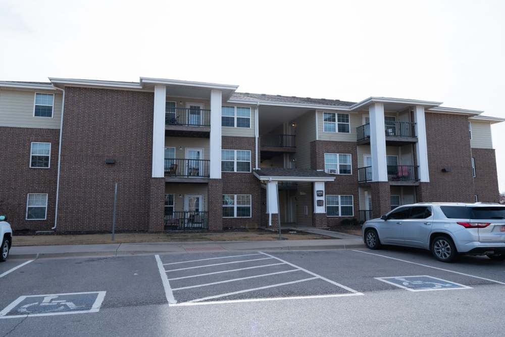 Exterior view of affordable apartments  with parking space at Fairway Breeze in El Reno. OK