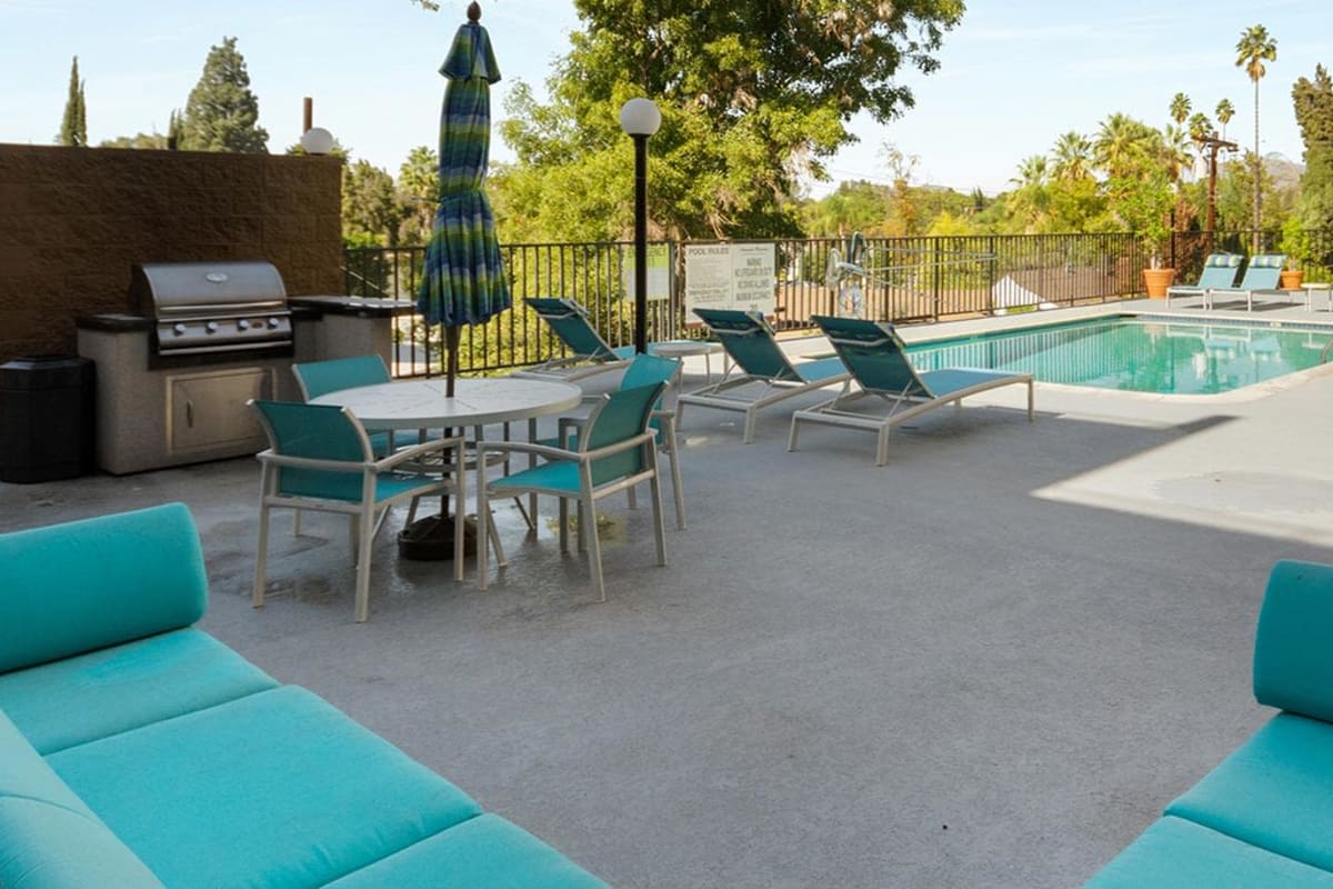 Barbeque area near pool at Amanda Regency Apartments, Van Nuys, California