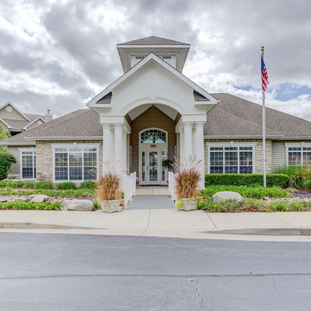 Charming entrance with inviting landscaping at Boulder Springs in Maryland Heights, Missouri.