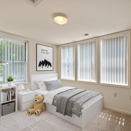 A furnished and well-lit bedroom in a home at Carpenter Park in Patuxent River, Maryland