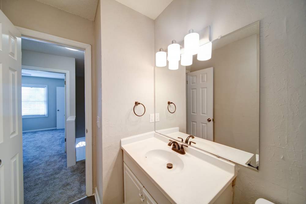 Washroom with mirrors near The Manor Townhomes in Winston-Salem, North Carolina