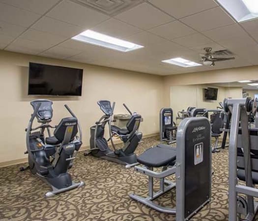 Fully equipped fitness center at The Marquis at the Woods in Webster, New York