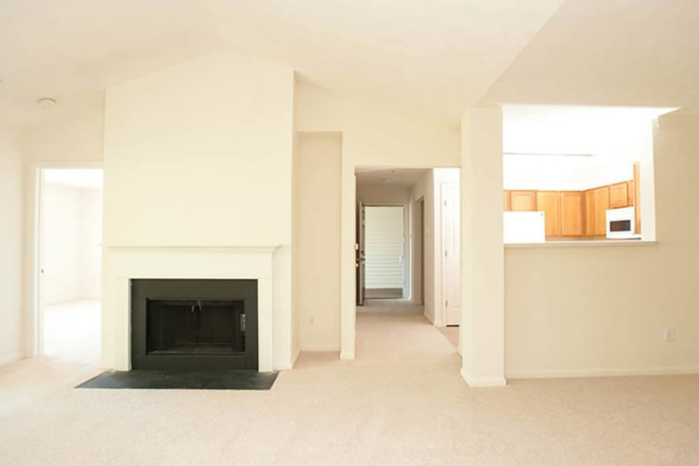 Living room with fireplace at Beaumont Farms Apartments in Lexington, Kentucky