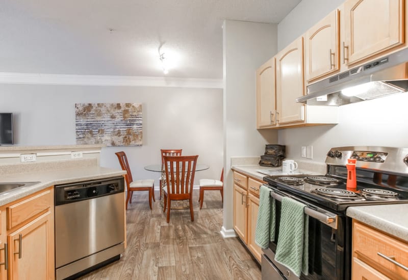 Dinning room adjacent to an open kitchen at Peachtree Landing in Fairburn, Georgia