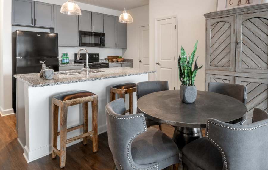 Dining table and kitchen at The Heron Downtown in Baton Rouge, Louisiana
