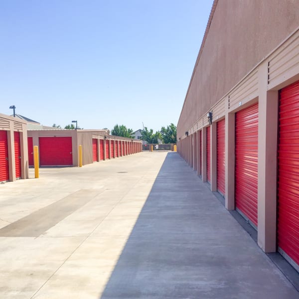 Storage units with bright doors at StorQuest Self Storage in Arlington, Texas