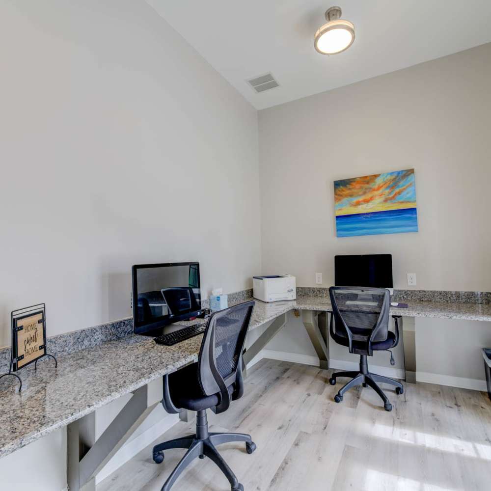 Stylish home office with sleek granite countertops and modern dual workstations at Boulder Springs in Maryland Heights, Missouri.