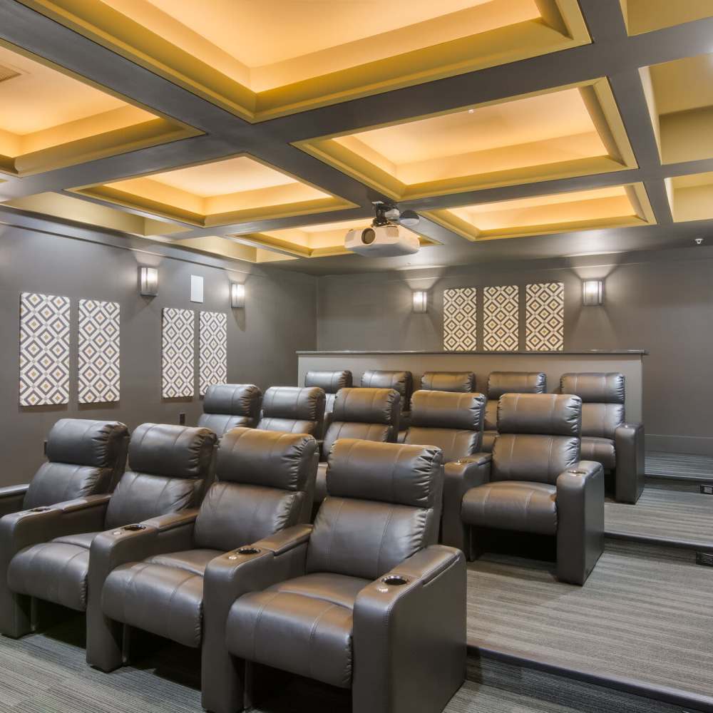 Luxury theater with reclining leather seats at The Apartments At Kelton Station in Williamsburg, Virginia
