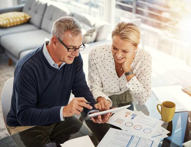 Senior resident discussing in the community room at Camino Al Oro in Los Angeles, California