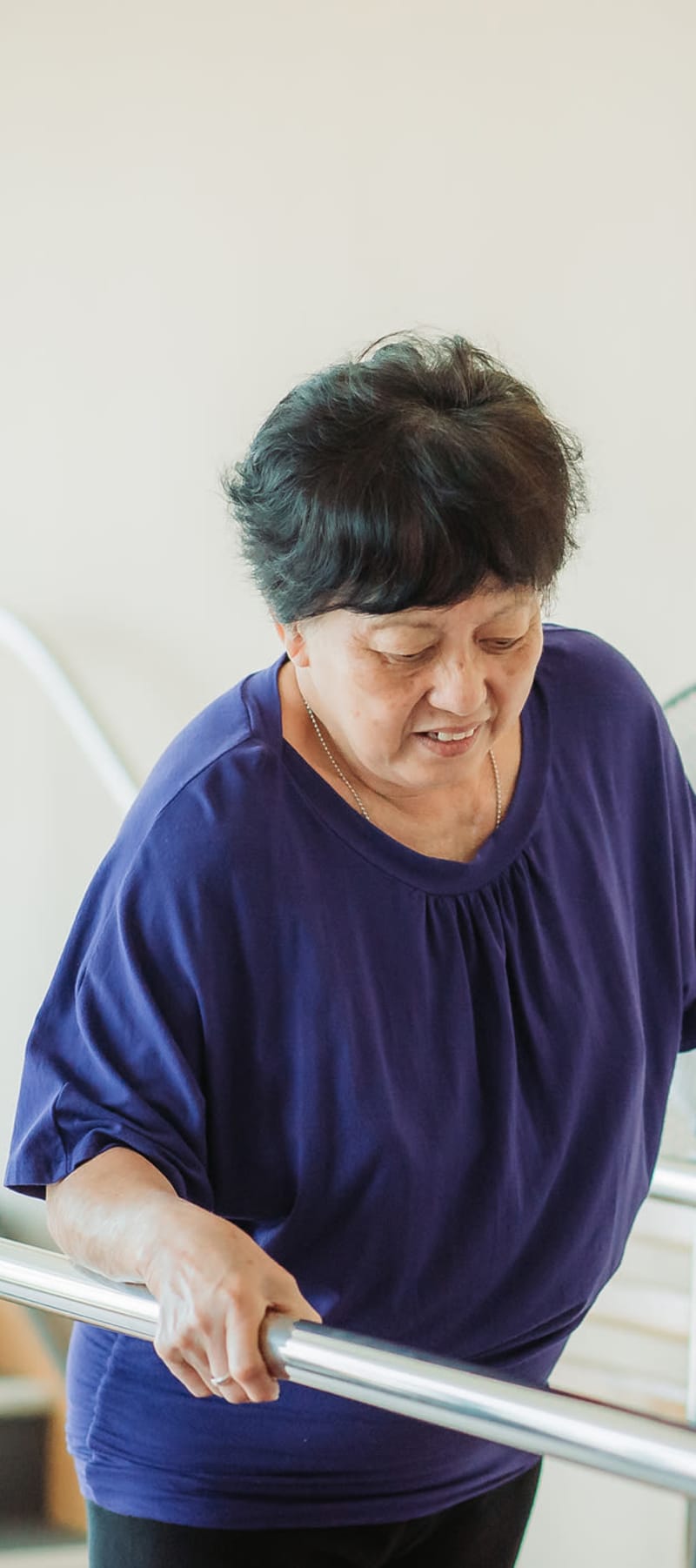 Resident in rehabilitation walking with assistance at Ingleside Communities in Mount Horeb, Wisconsin