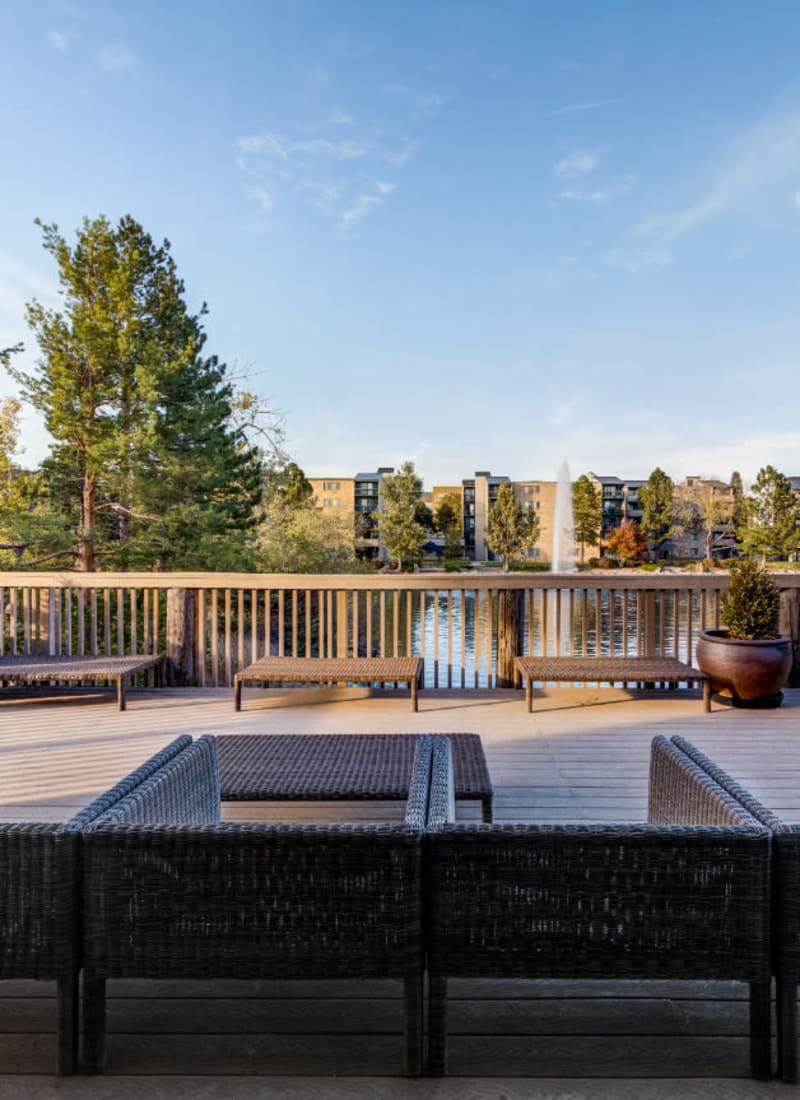 Outdoor sitting area overlooking lake at Ashford Belmar in Lakewood, Colorado