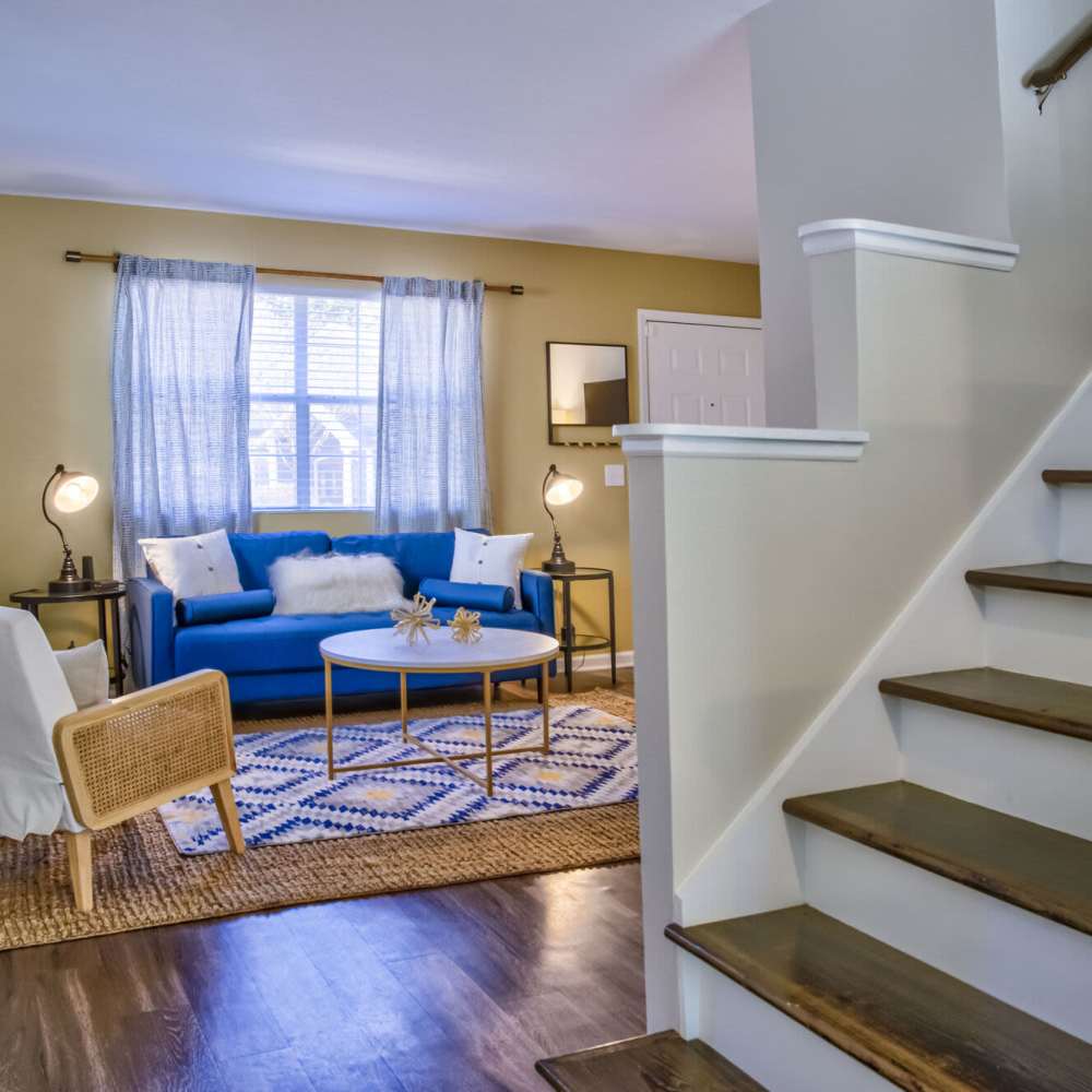 Living room with staircase at Avonlea Westside in Atlanta, Georgia