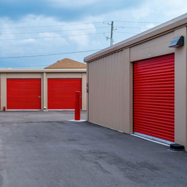 Outdoor storage units with red doors at StorQuest Express Self Service Storage in Sonora, California
