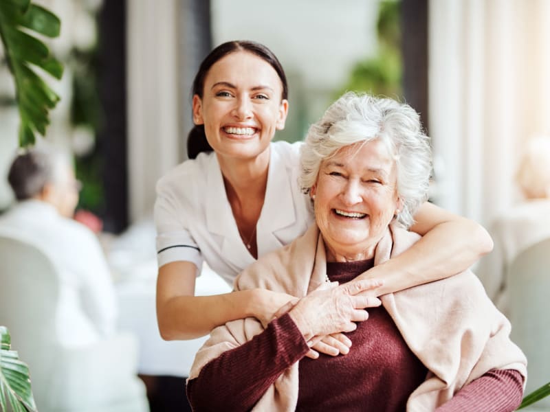 Resident and resident smiling and having fun together at Transitions At Home in Elkhorn, Wisconsin