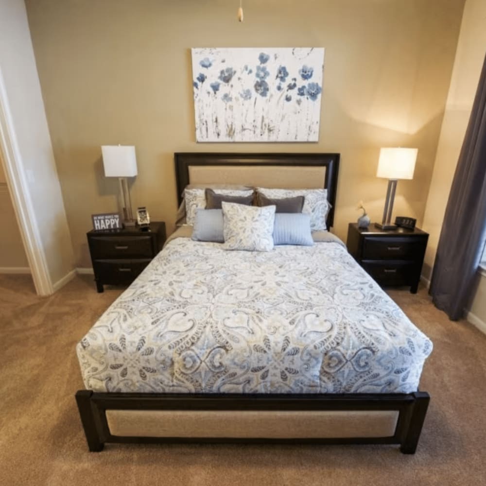 Bedroom with large comfortable bed at Dominion Park in San Antonio, Texas