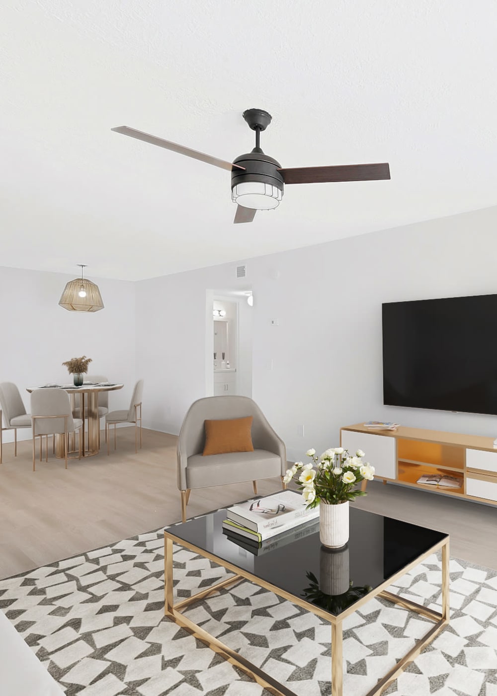 Living room with ceiling fan at Bentley Green Apartment Homes, Jacksonville, Florida