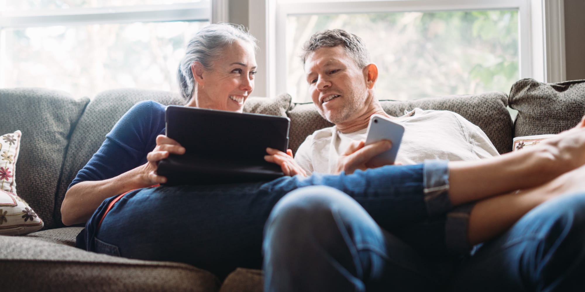 Happy residents surfing the web in their new Cambridge Management Services, Inc. home in Altamonte Springs, Florida