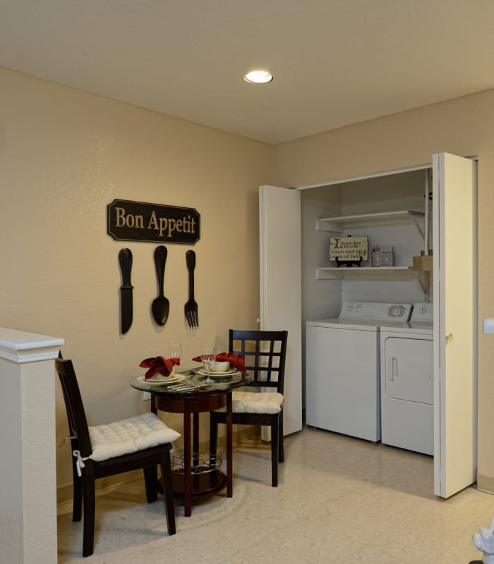 Carpeted living room at Acacia Park Apartments in El Paso, Texas