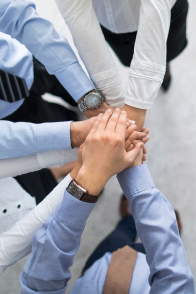 Team handshake at AG Living in Dallas, Texas