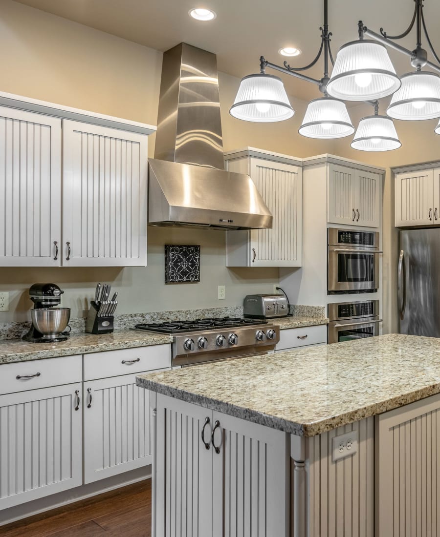 Luxurious kitchen with modern stainless-steel appliances at Delano in Redmond, Washington