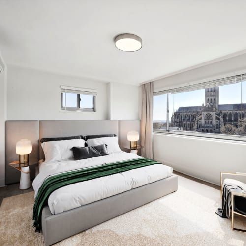 Bedroom with large windows at The Conwell in Washington, District of Columbia