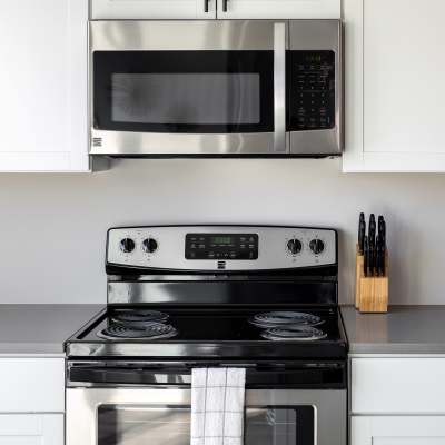 Stainless steel microwave above black stove at 223 E Town in Columbus, Ohio