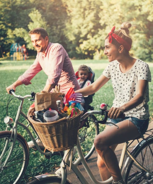 Residents out for a bike ride near Palm Lake Apartment Homes in Concord, California