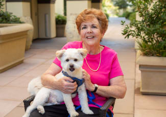 Resident and dog at senior living in Gilbert