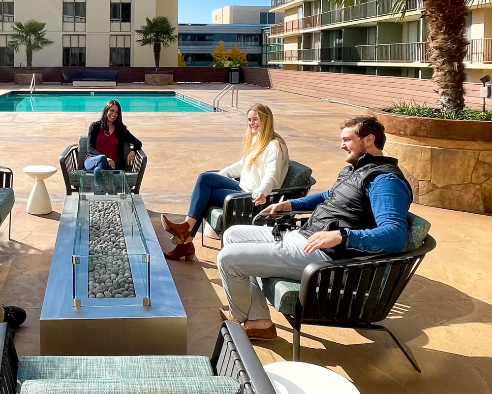 Outdoor lounge and fitness area at Hillsborough Plaza Apartments in San Mateo, California