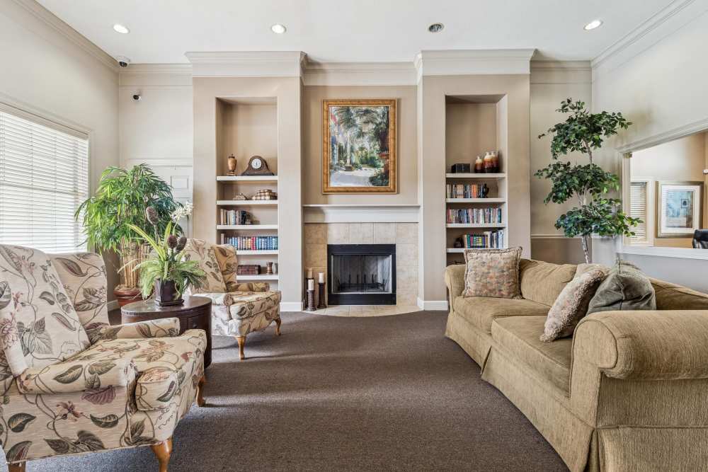 Community hall having a fireplace at Kimberly Pointe in Houston, Texas