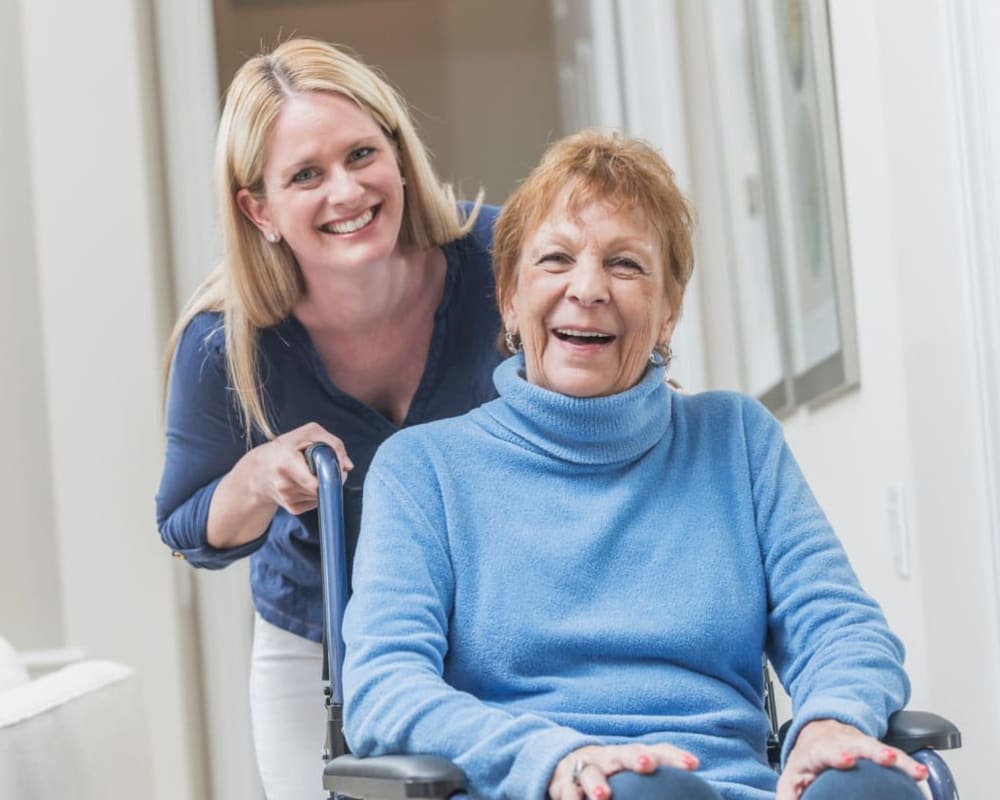 Resident being pushed in her wheelchair at Lawton Senior Living in Lawton, Iowa.