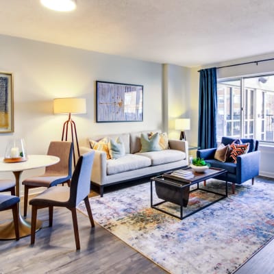 Spacious living room with large bay window at Sofi at 50 Forest in Stamford, Connecticut