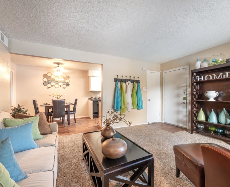 Comfortably decorated living area in a model home at 8500 Harwood Apartment Homes in North Richland Hills, Texas