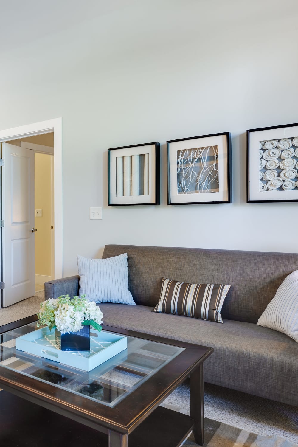 Spacious and modern living room in a model home at Arcadia at Rivers Edge in Medford, Massachusetts